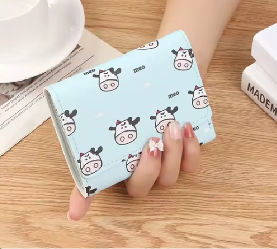 Win 1 of 2 Cow Print Wallets